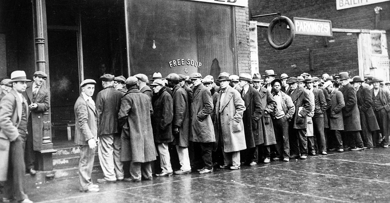 The Great Depression. Unemployed men queued outside a soup kitchen opened in Chicago by Al Capone. The storefront sign reads 'Free Soup, Coffee and Doughnuts for the Unemployed.' Chicago, 1930s (Newscom TagID: evhistorypix027753.jpg) [Photo via Newscom]